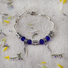 Handcrafted Charm Bracelet With Blue And Silver Beads at Qtrove