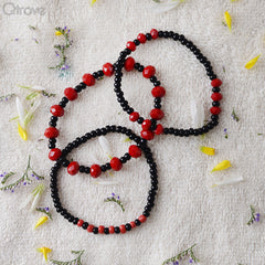 Set of Three Bracelets With Black And Red Beads at Qtrove