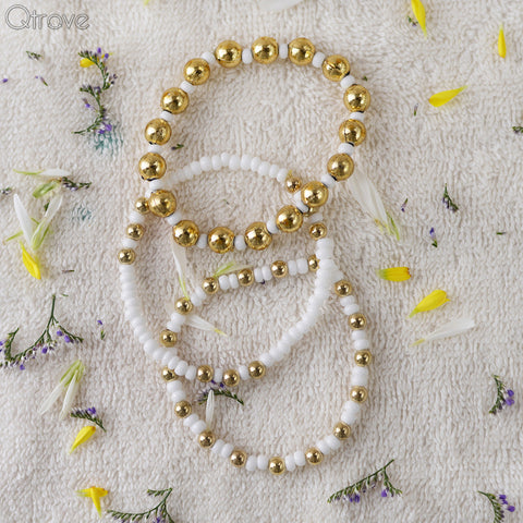 Set Of Three Bracelets With Golden And White Beads