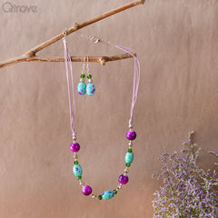 Handcrafted Threaded Necklace With Purple And Green Beads at Qtrove